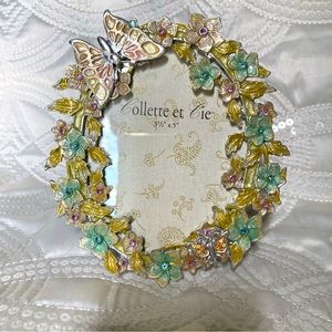 Picture frame silver tone butterfly decor.